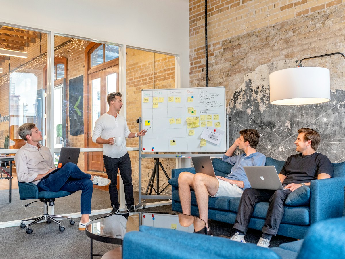 A team in a whiteboard session in a bright office
